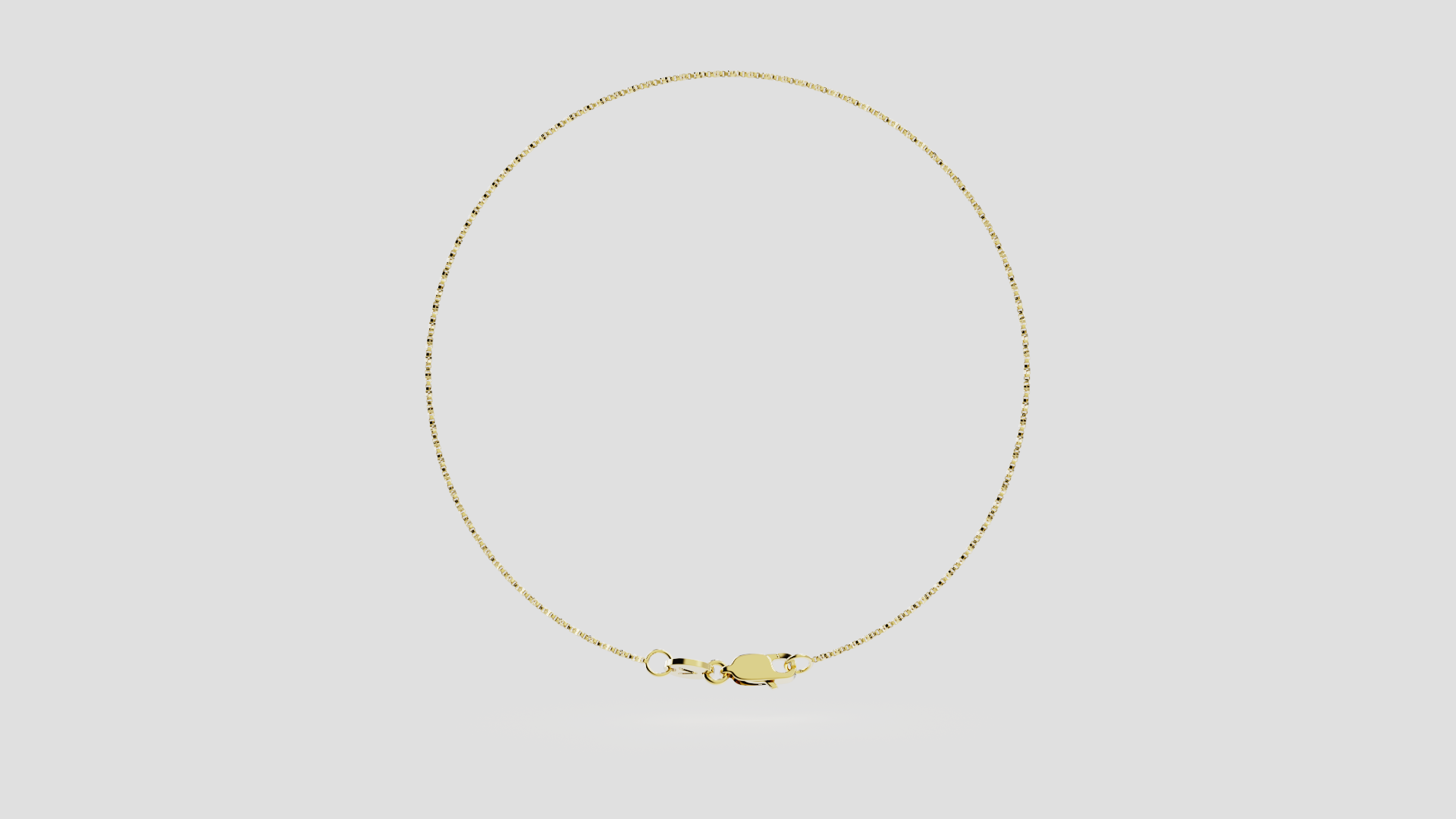 rounded gold chain anklet on white background